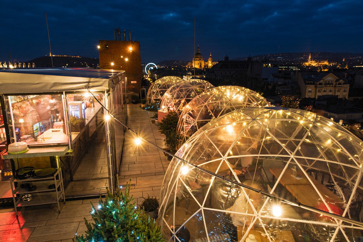 Illuminated igloos overlooking Budapest at night