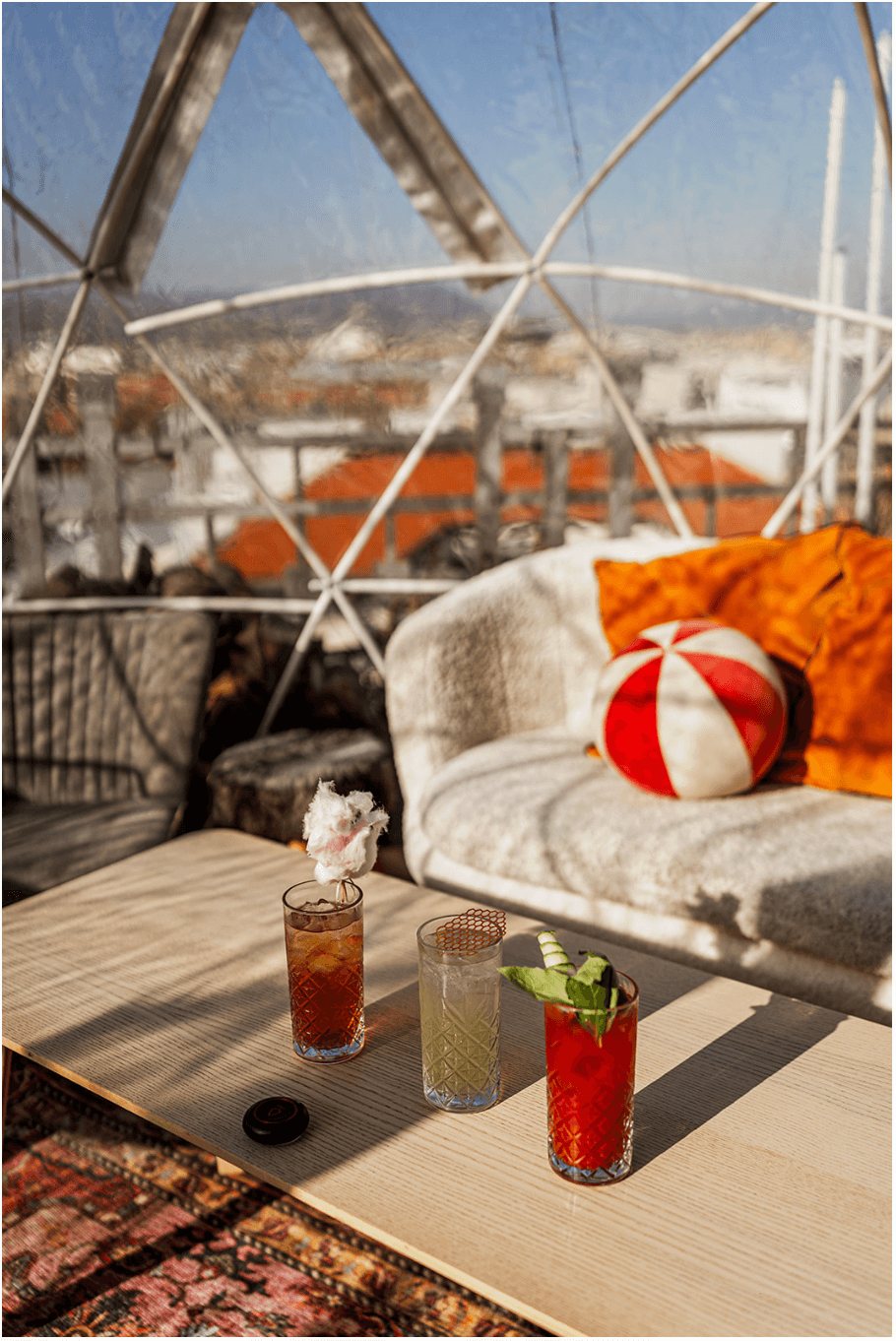 Cocktails and a table set inside an igloo
